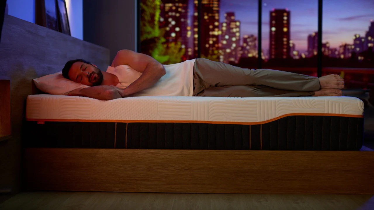 Side sleeper resting on an Emma mattress at night
