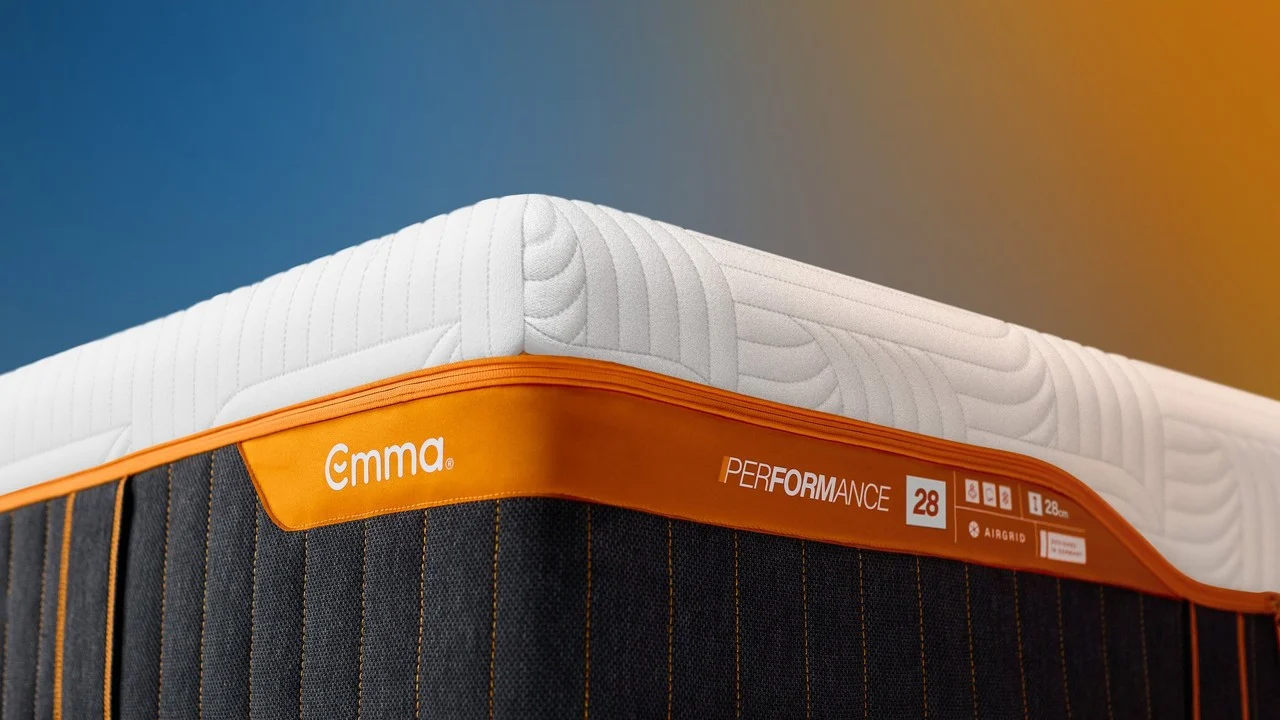White quilting and orange trim on the Emma Performance 28 mattress